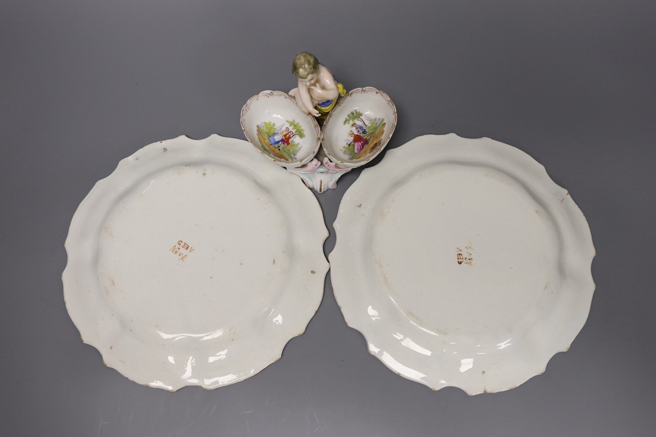 A pair of Meissen onion pattern candlesticks, 14 cm high, a Berlin figural salt, two Nove maiolica plates and a Richard Gingrich cache pot